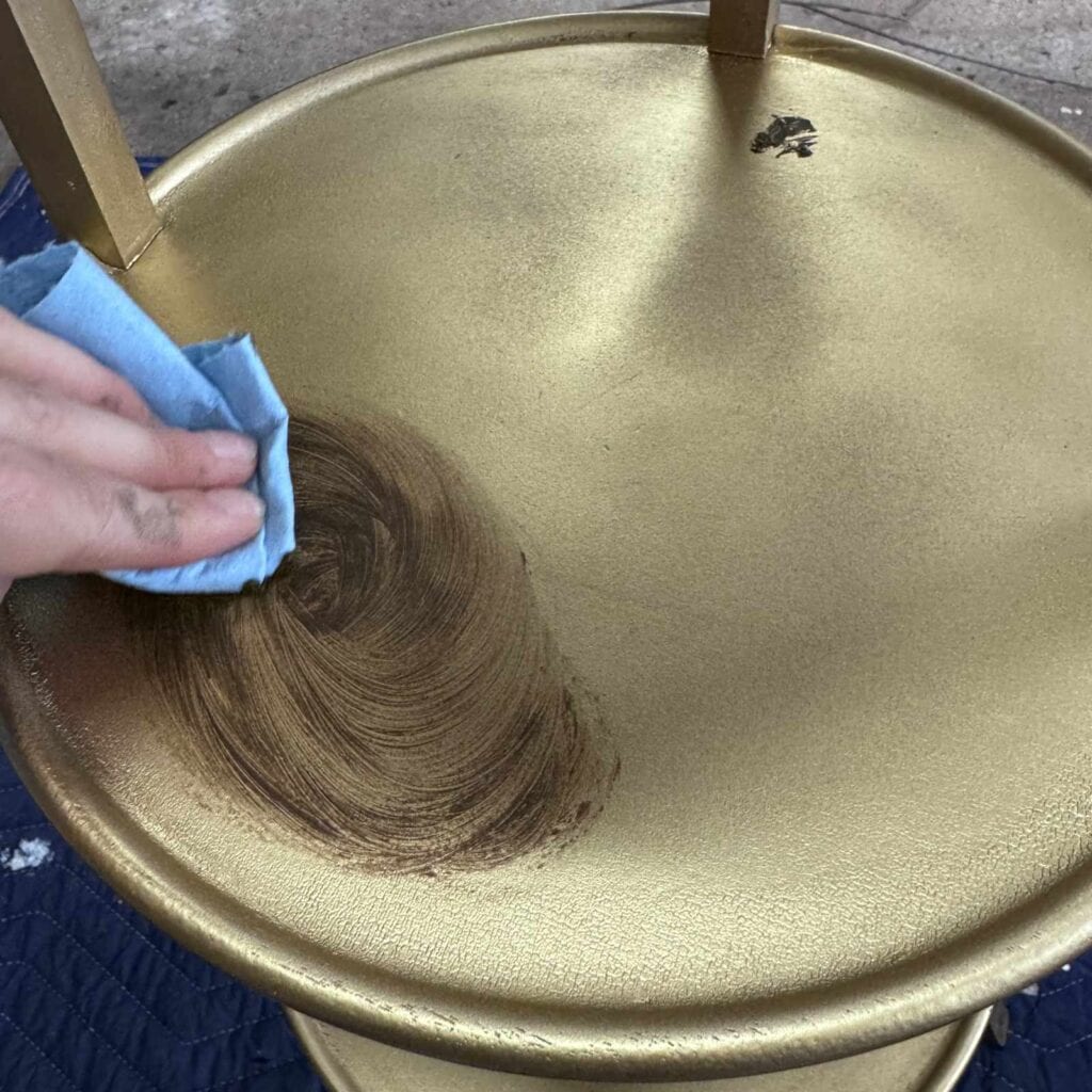 Adding brown wax to the plant stand.