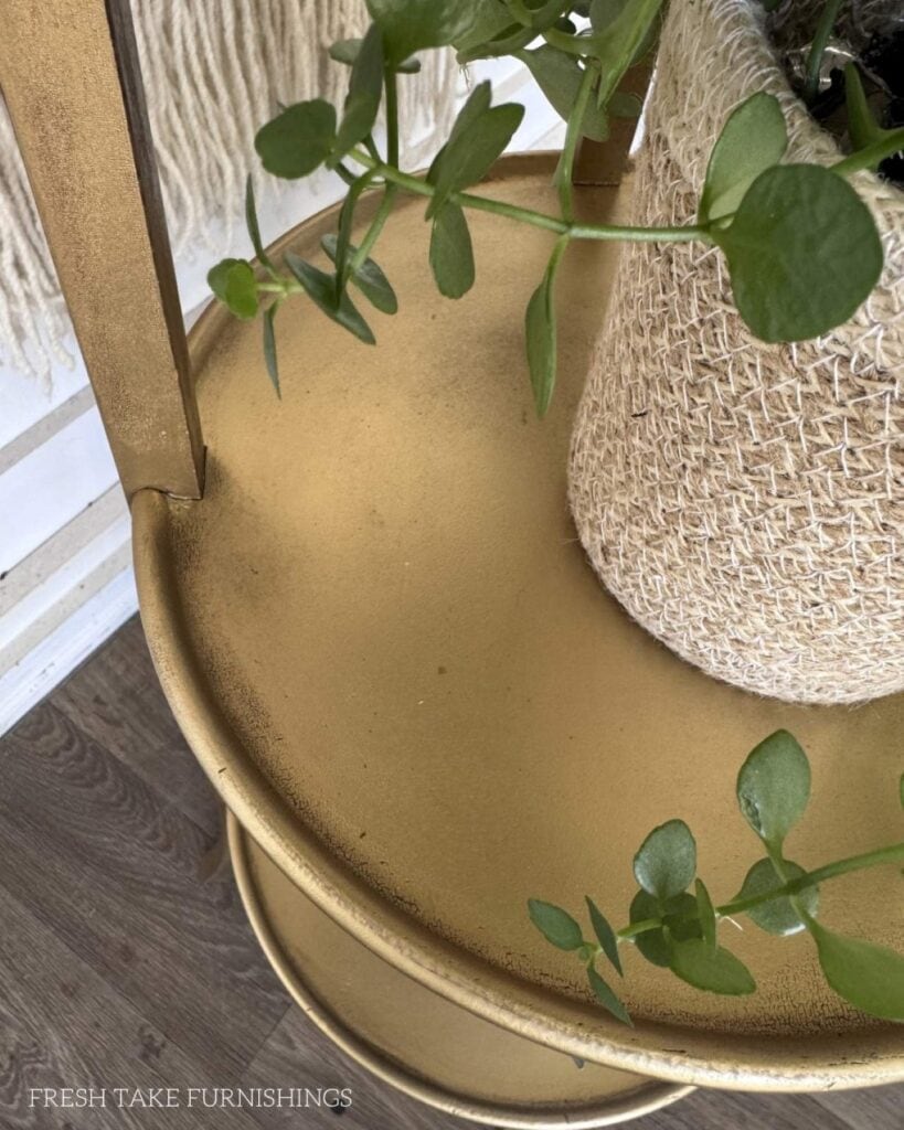 Close up of aged finish on the plant stand.